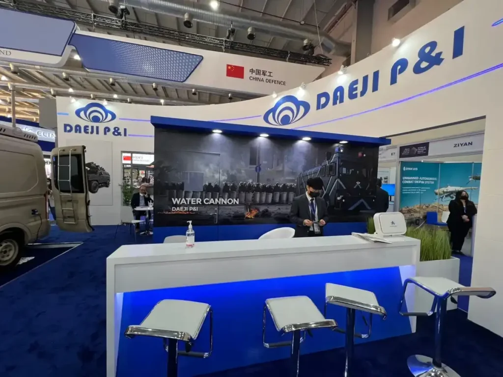 Contemporary DAEJI P&I exhibition booth with branded meeting space and defense technology displays