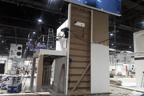 Rear structural view of double-decker exhibition booth during framework installation and construction process