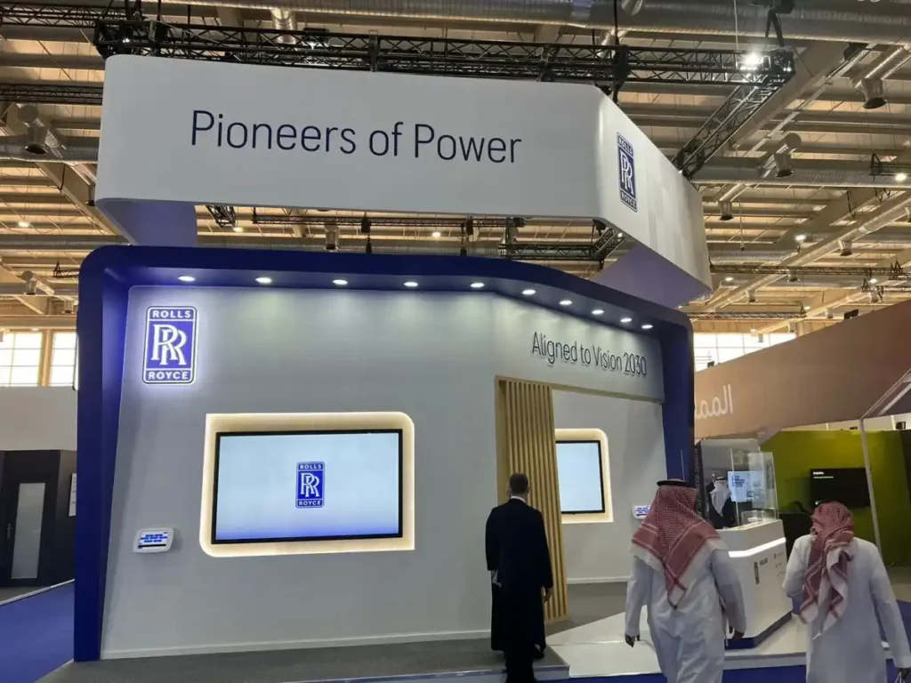 Rolls-Royce exhibition pavilion showcasing modern defense technology booth at international trade event.