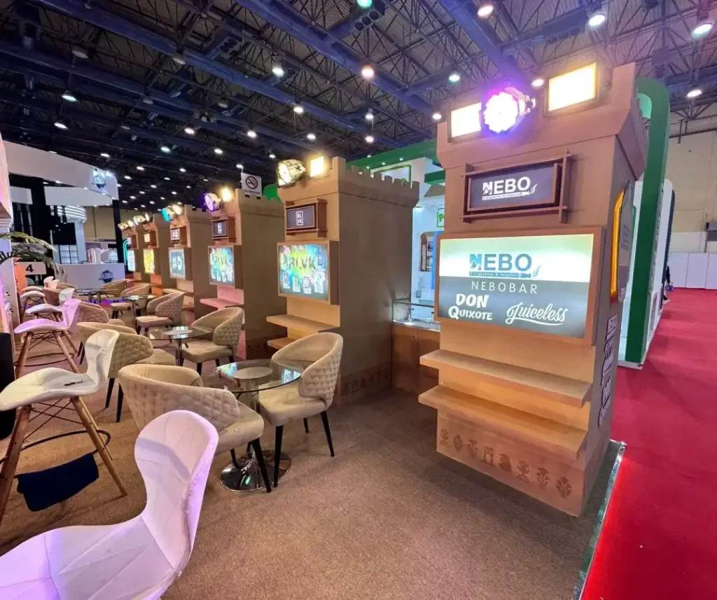 booth-front Front view of a custom Egyptian-inspired exhibition booth with illuminated entrance and display counters