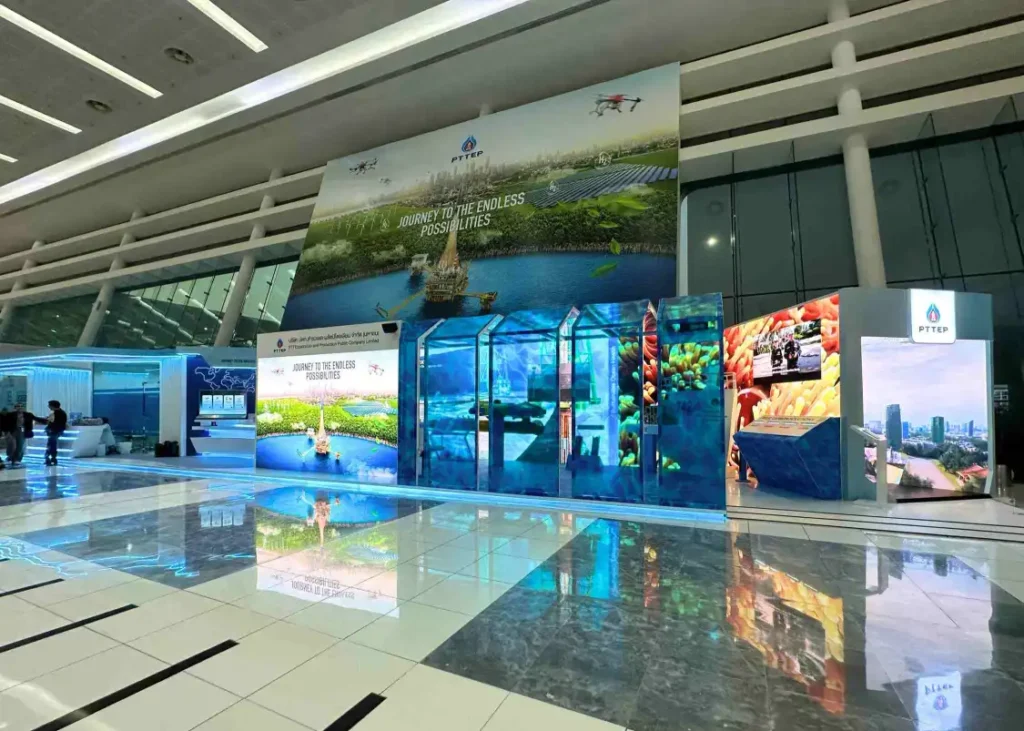 PTTEP custom exhibition stand with immersive digital displays and interactive event setup Filename: