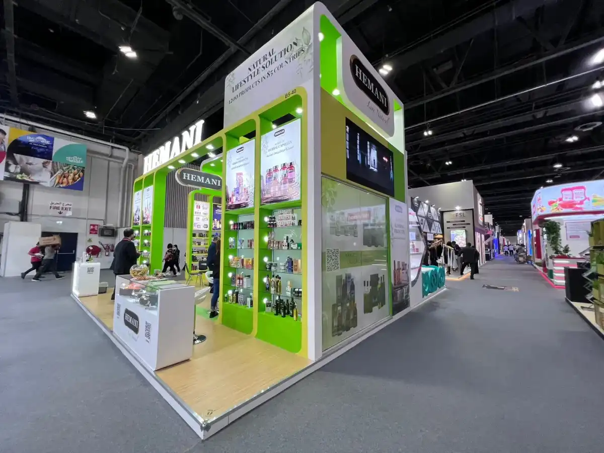 Hemani exhibition stand with illuminated product displays and custom trade show booth design