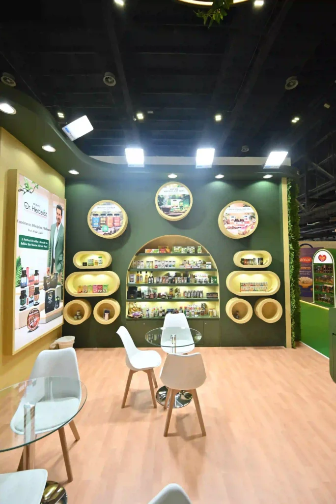 Custom exhibition booth interior featuring circular displays and illuminated product shelving