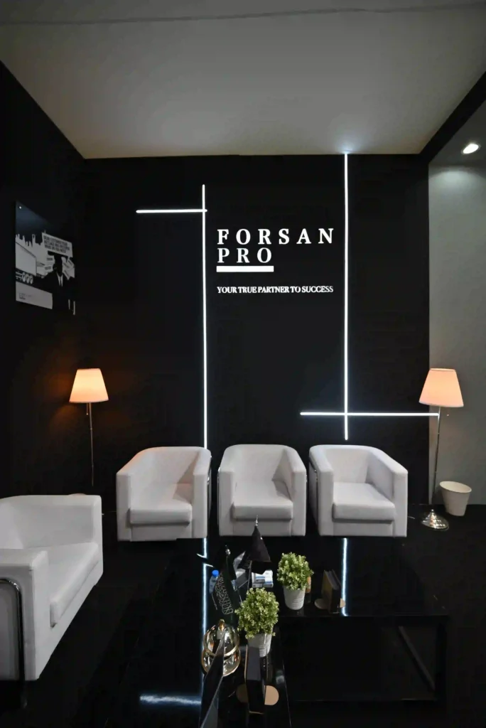 Forsan Pro branded lounge area with modern seating and illuminated wall design