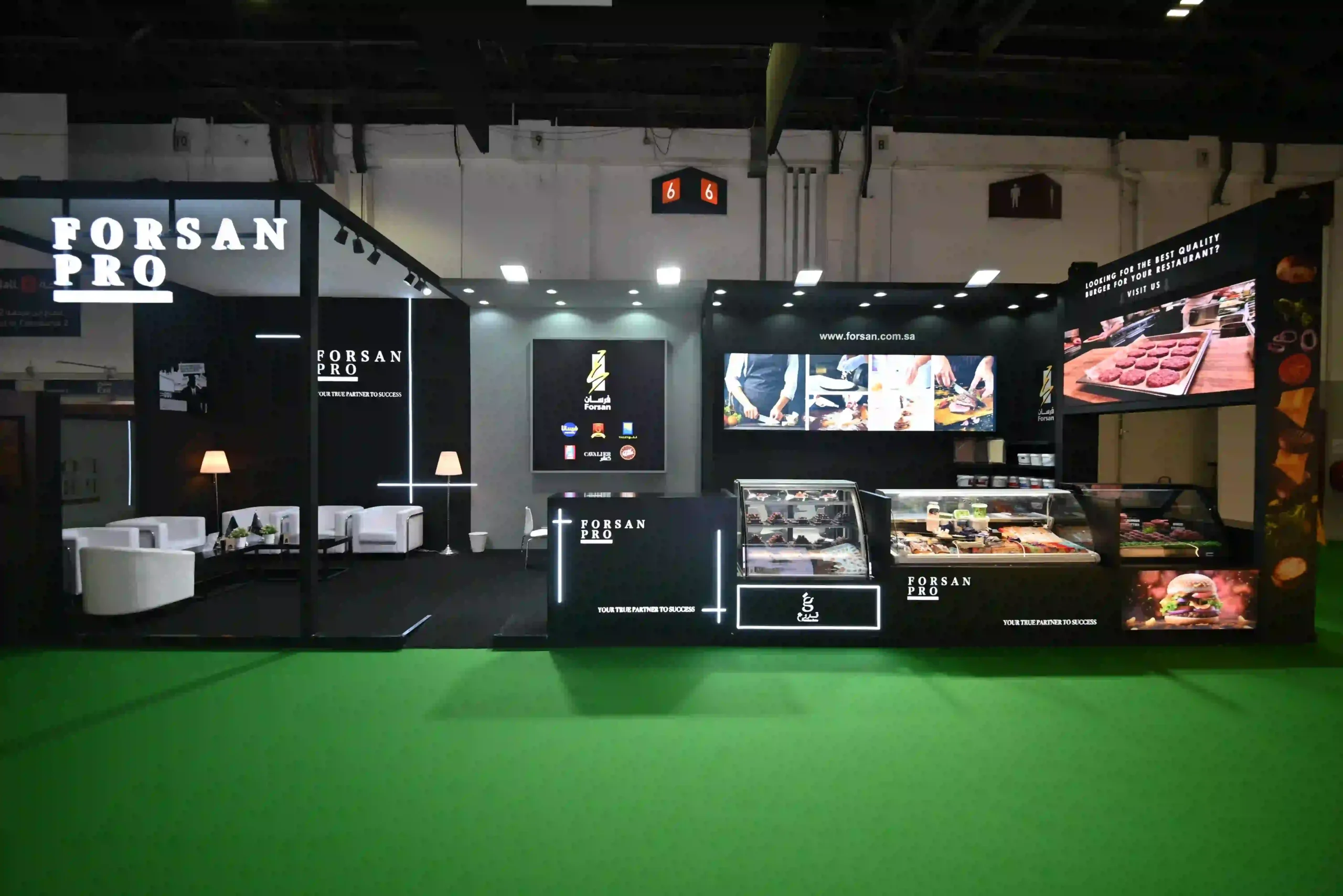 Forsan Pro custom exhibition stand featuring product displays, seating and digital screens