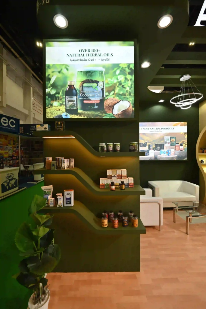 Hemani trade show booth featuring illuminated shelves and natural wellness product displays