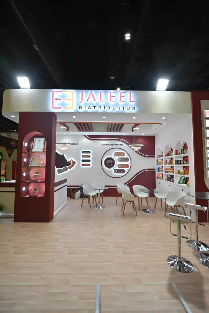 Jaleel Distribution custom exhibition stand featuring branded graphics, seating and product shelves