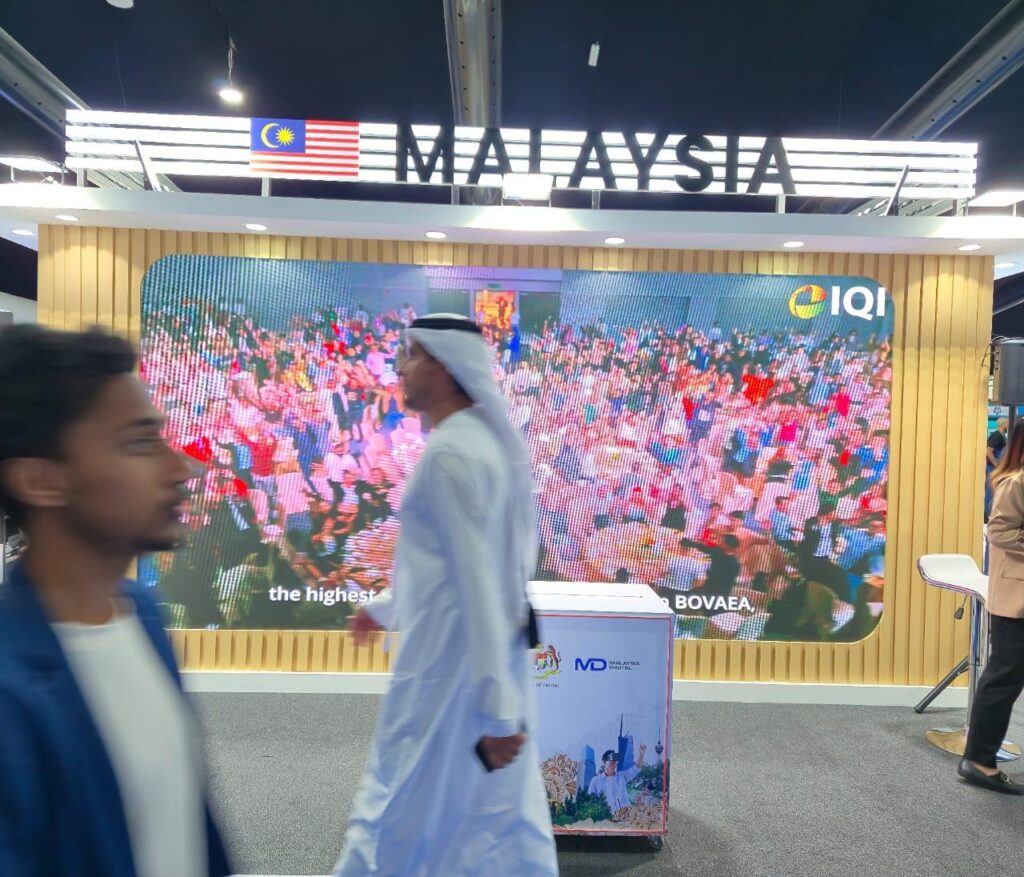 Malaysia Digital event setup featuring large LED screen and illuminated exhibition branding
