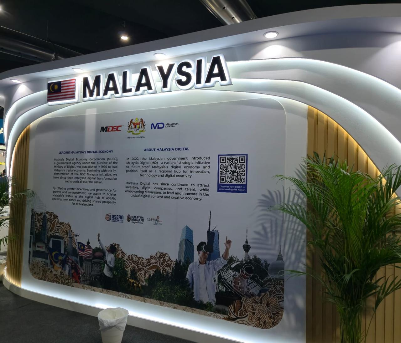 Malaysia Pavilion exhibition stand with illuminated signage and display wall at GITEX