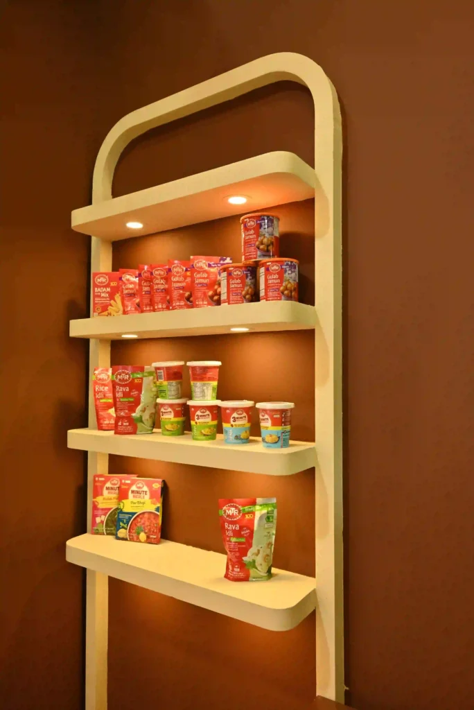 Illuminated product display shelf showcasing packaged food items inside exhibition booth