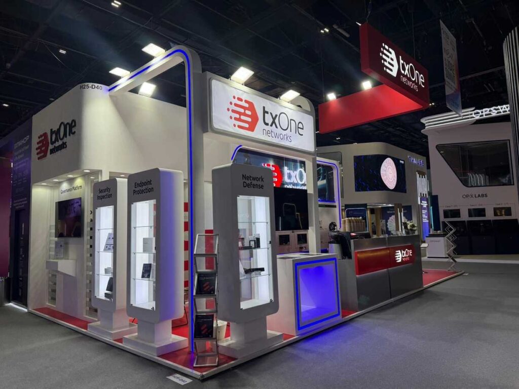 txOne Networks exhibition booth featuring product displays and branded reception