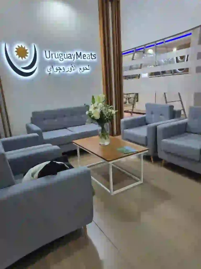 Uruguay Meats exhibition lounge with illuminated branding and modern seating area