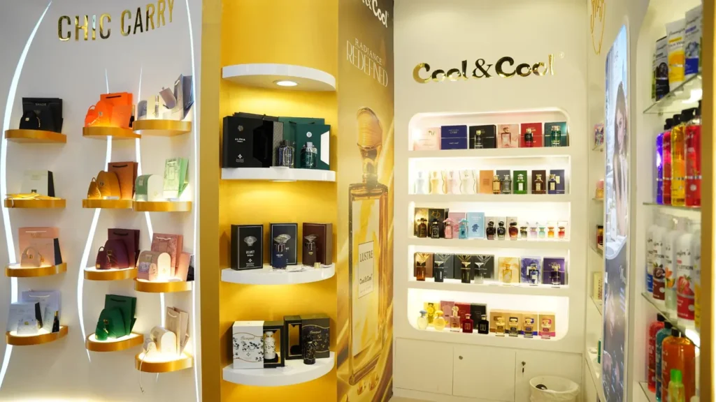 Luxury perfume exhibition stand with illuminated product displays and elegant gold finishes.